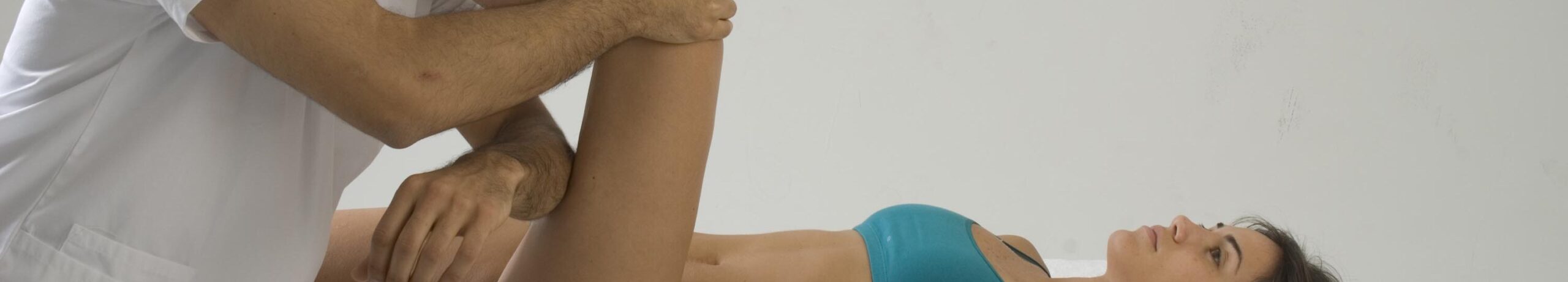 Philippe Tadger performing a manual therapy technique on a relaxed patient